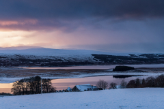 Snowy sunset over Loch Shin