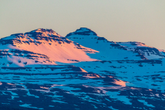 Alpenglow on the mountains behind Djupivogur