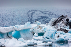 telephoto view of icebergs calving from Breiðamerkurjökull glacier