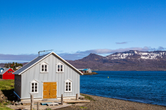 Building on the edge of the harbour at Neskaupstaður, Eastfjords, Iceland
